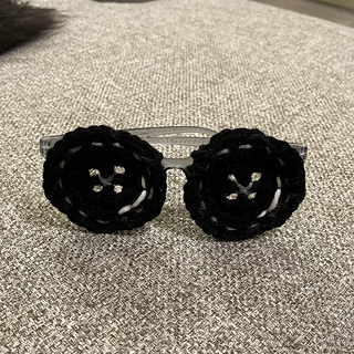 Buttons sewn to a dollar tree pair of glasses with the lenses removed.