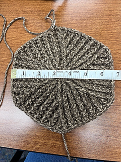 After adding 2 more SETS of increases (additional 4 rounds, based on "Round 5" and "Round 6", following pattern for size large), my diameter was 6.5”.  “Round 7” will add 1/2” more.  Total diameter should get me close to a circumference of 22" (circ = pi * diameter).