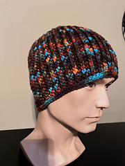 Nevada dusk (light-to-normal weight), two extra sets of increase rounds, 8.5” tall, 125 grams. Big, fits me nicely though, used my bigger mannequin head.  Nice colorway for this pattern.