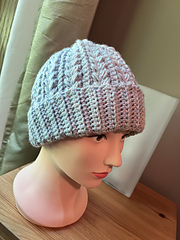 Pastels (small skein).  40 sts (12 sc longer brim).  15 repeats, 19.5” circ, about 10”, 119 g.  Needed second skein to finish last 2 rows.  Last 4 crown sts (heading toward crown): slip st BLO.  First 4 crown sts (heading away from crown): slip st BLO in first 2 sts, sc BLO in next 2 sts.  