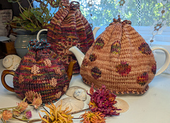 L to R: Small, Large (in back with sunflower motif), Medium
