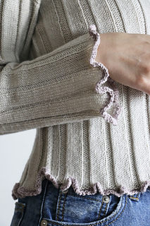 ruffled cuff and hem.