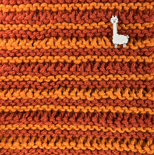 100% acrylic Red Heart Super Saver yarn with U.S. #9 (5.5mm) and U.S. #15 (10mm) needles