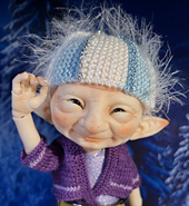 Hat fits a 6 inch circumference doll head.